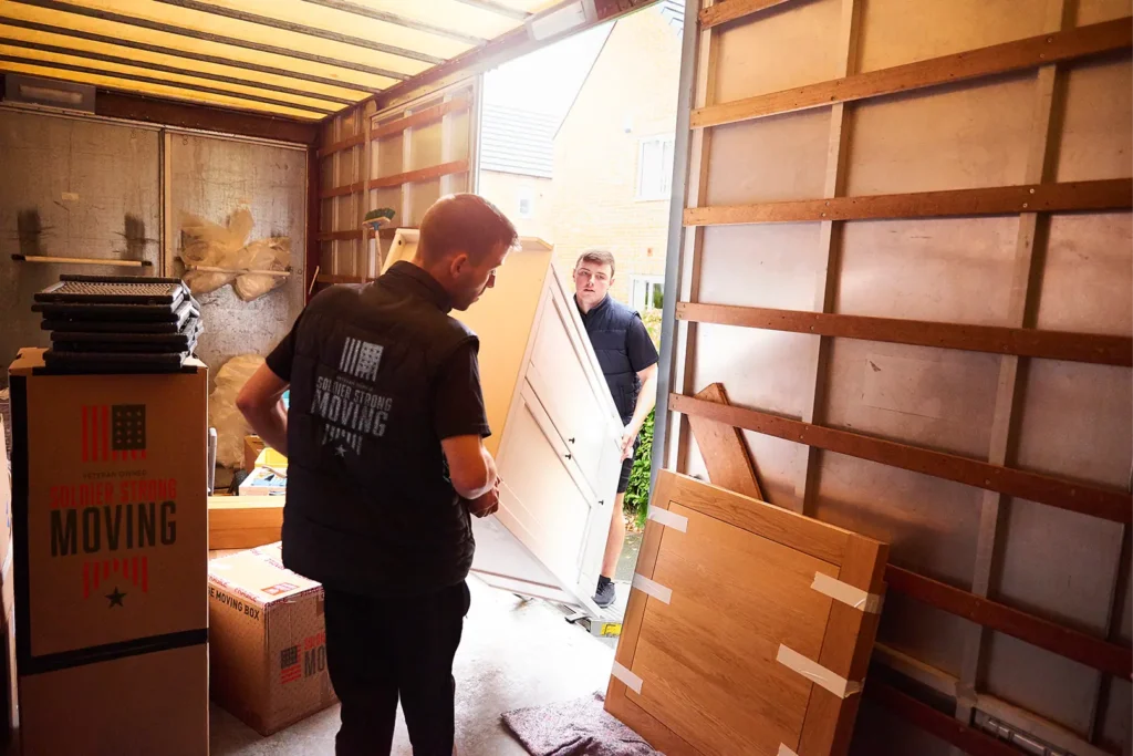 Image of movers taking items out of the truck