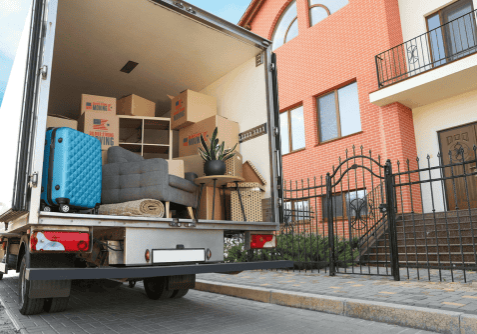 professional moving truck parked in front of a house