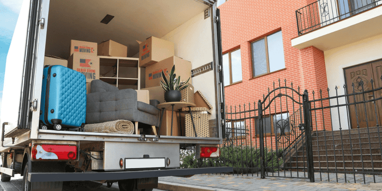 professional moving truck parked in front of a house